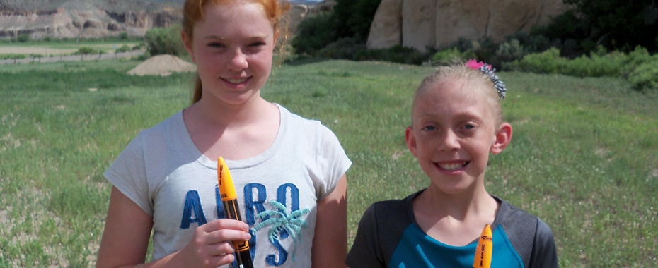 Two Young Ladies About to Launch Their Project Rockets