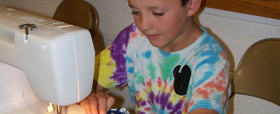 A Young Man Working on a Sewing Project