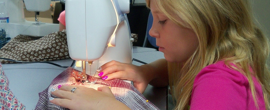 A Young Lady Working on a Sewing Project